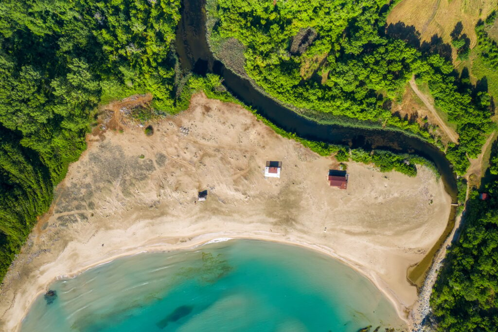 Aerial top view of a wild sandy beach